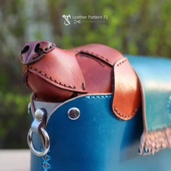 Detailed macro shot of the sleeping dog's face, a key artistic element of this artisan leathercraft pattern.