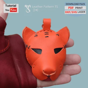Leather tiger pattern – example of finished keychain from template, front view in hand