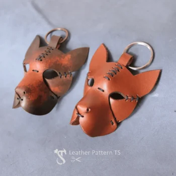 Leather dog keychain template front view showing two brown dog charms with rivets