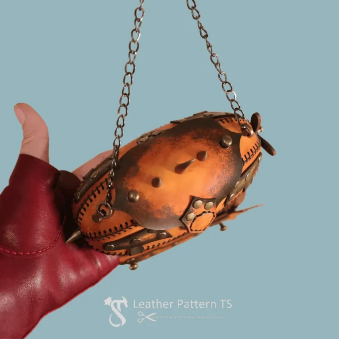Leather airship box pattern handheld showing rounded body and riveted design