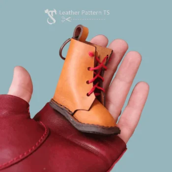 DIY leather boot charm template handheld front view with detailed stitching