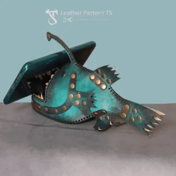 DIY leather fish holder used as phone stand with open jaws supporting screen