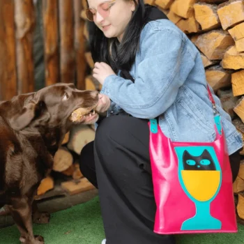 DIY leather tote bag template worn crossbody with dog interaction outdoors